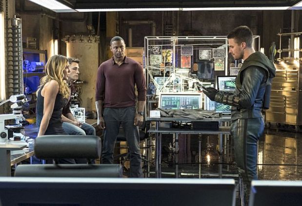 Arrow -- "The Magician" Pictured (L-R): Katie Cassidy as Laurel Lance, Colton Haynes as Roy Harper, David Ramsey as John Diggle, and Stephen Amell as Oliver Queen -- Photo: Ed Araquel/The CW -- ÃÂ© 2014 The CW Network, LLC. All Rights Reserved.