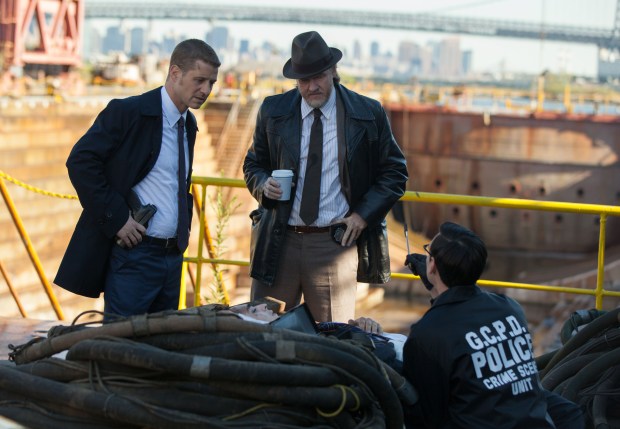 GOTHAM: Edward Nygma (Cory Michael Smith, R) and Detectives James Gordon (Ben McKenzie, L) and Harvey Bullock (Donal Logue, C) examine a crime scene in the "The Mask" episode of GOTHAM airing Monday, Nov. 10 (8:00-9:00 PM ET/PT) on FOX. ©2014 Fox Broadcasting Co. Cr: Jessica Miglio/FOX
