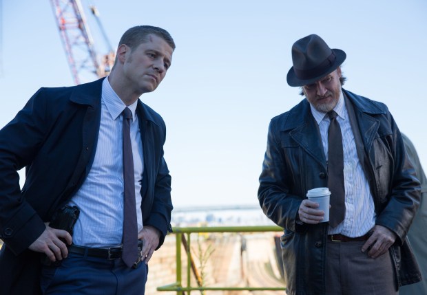 GOTHAM: Detectives James Gordon (Ben McKenzie, L) and Harvey Bullock (Donal Logue, R) examine a crime scene in the "The Mask" episode of GOTHAM airing Monday, Nov. 10 (8:00-9:00 PM ET/PT) on FOX. ©2014 Fox Broadcasting Co. Cr: Jessica Miglio/FOX