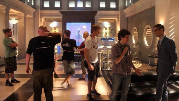 Director Rachel Talalay on set with cast and crew members.