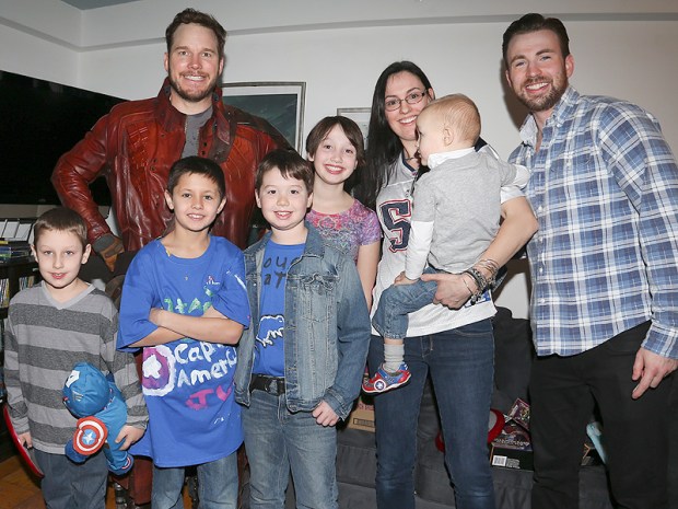 Chris Pratt (left) poses with a family at Christopher's Haven with Chris Evans (far right) BRITA MENG OUTZEN / CHRISTOPHER'S HAVEN
