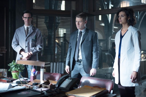 GOTHAM:  L-R:  Edward Nygma (Cory Michael Smith), Detective James Gordon (Ben McKenzie) and Dr. Leslie Thompkins (guest star Morena Baccarin) have information for Captain Essen in the "The Blind Fortune Teller" episode of GOTHAM airing Monday, Feb. 16 (8:00-9:00 PM ET/PT) on FOX.  ©2015 Fox Broadcasting Co.  Cr:  Jessica Miglio/FOX