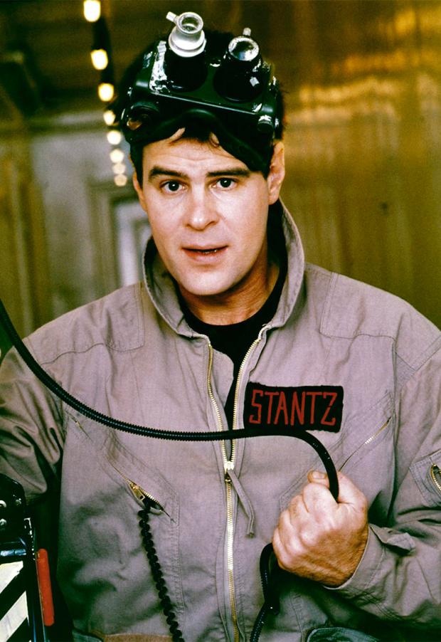 1984 --- American actor and screenwriter Dan Aykroyd on the set of Ghost Busters, directed by Ivan Reitman. --- Image by © Columbia Pictures/Sunset Boulevard/Corbis