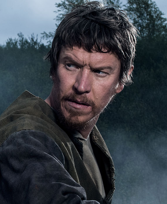 Sam Spruell stars as “Toran Prichard”: A strong but cynical Welsh farmer, Toran is Wilkin’s closest friend. He is forever loyal to his countrymen and will fight at whatever cost to protect them from noble abuses of power.